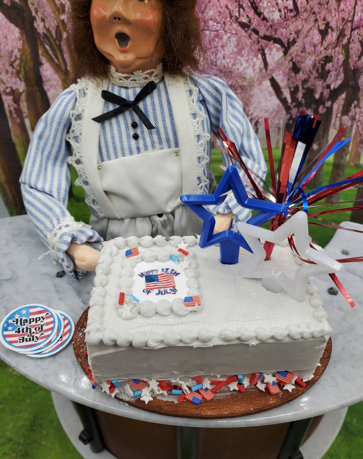 4th of July doll cake 1:4th scale dolls with festive decorations and a cheerful chef figure