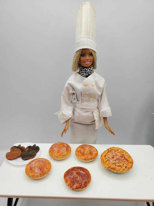 Chef Gina's Mini Food Doll with Assorted Pastries on White Table for Playtime Cooking Fun