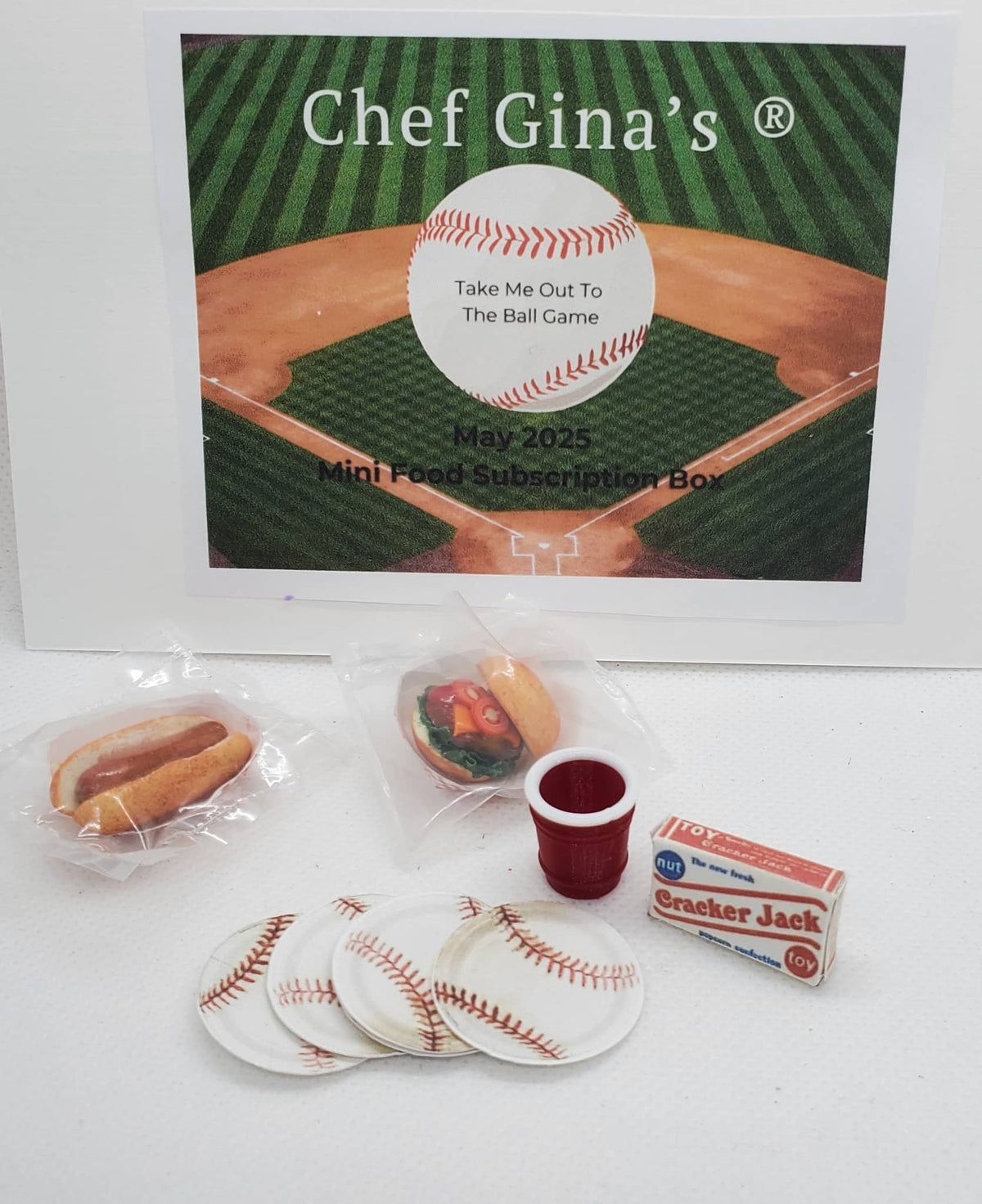 Chef Gina's 1:6 scale doll food subscription box with mini ballpark snacks including hot dogs and cracker jacks