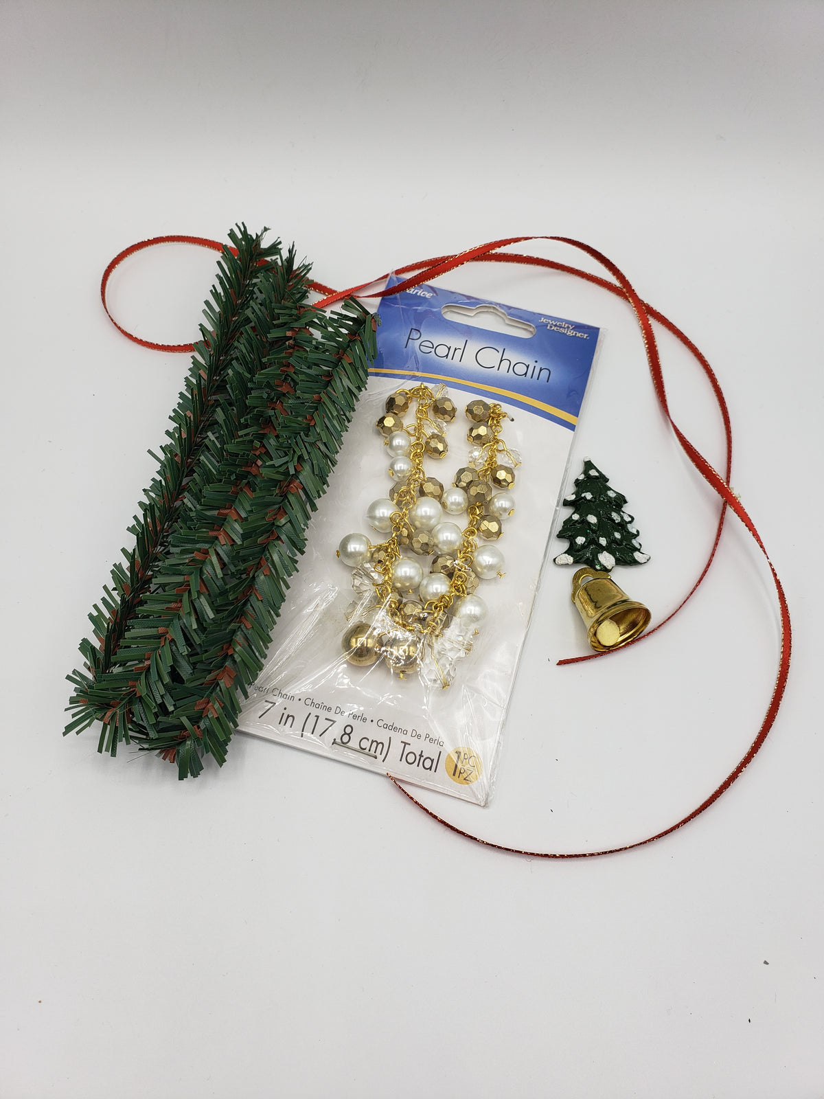 Chef Gina's beginner wreath making kit fashion dolls with green garland, gold bell, pearl chain, and red ribbon
