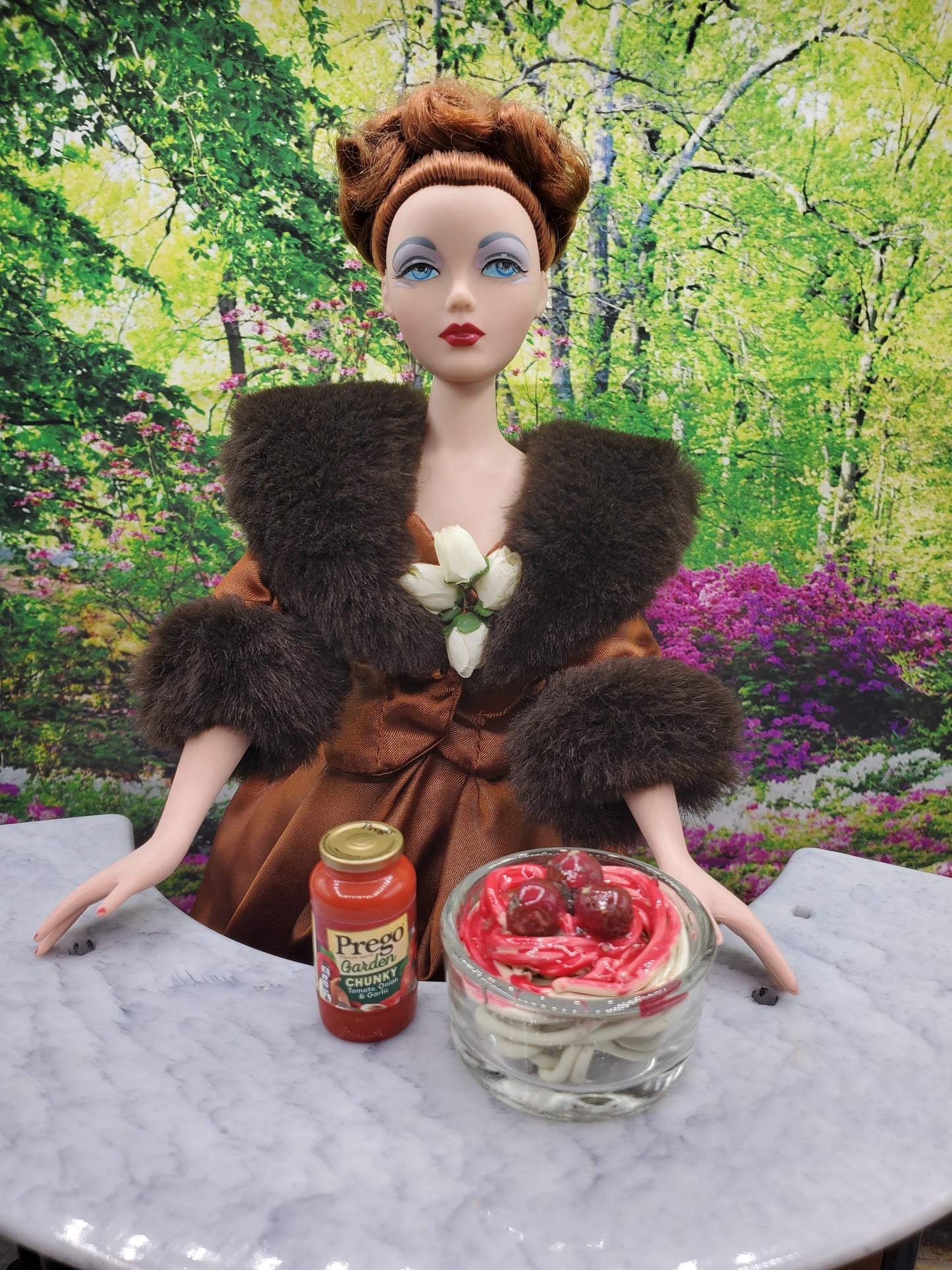 1:4th scale Spaghetti and Meatballs for dolls displayed with sauce jar and doll in outdoor garden setting