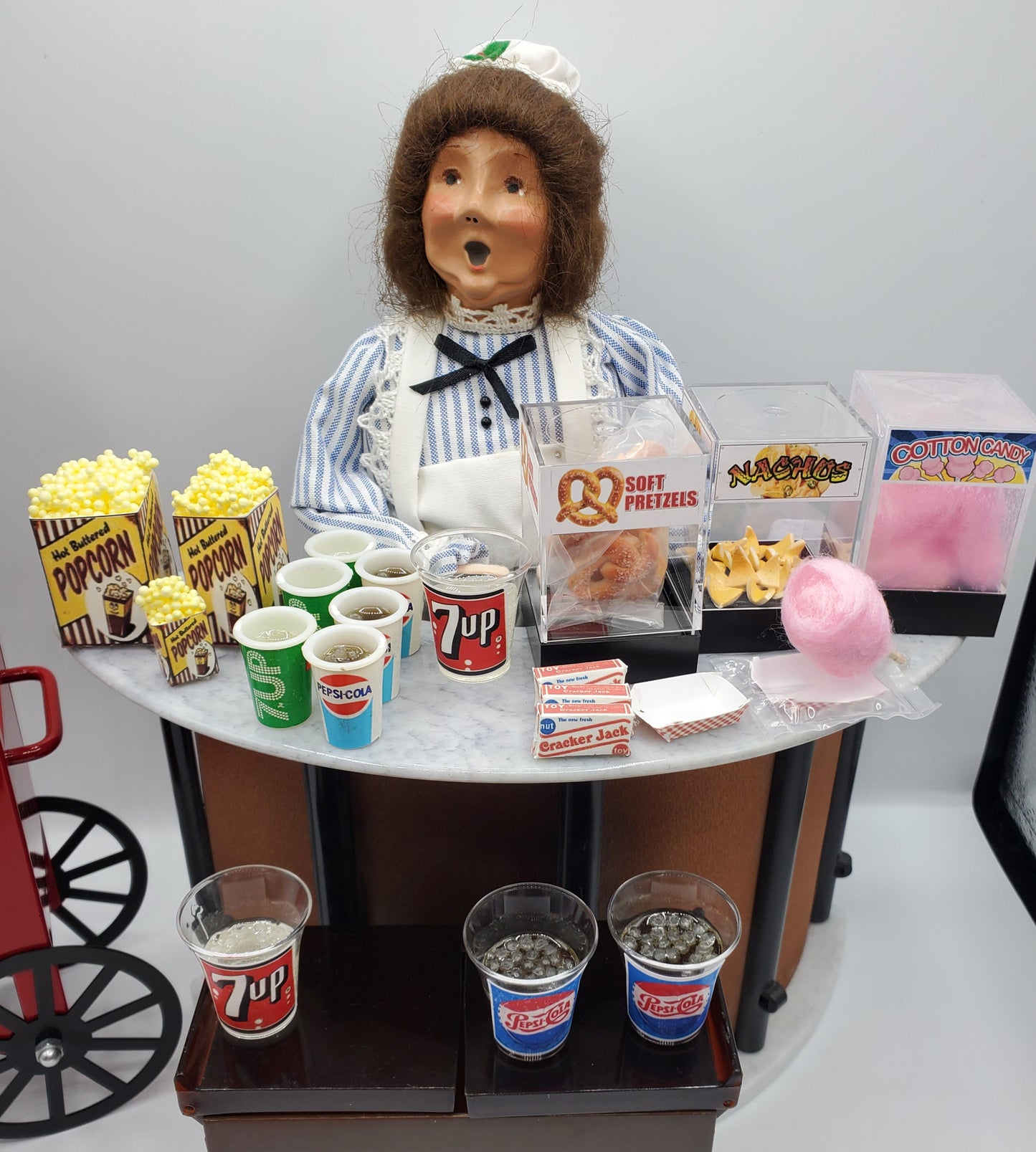 Chef Gina's handmade doll drink miniatures with popcorn, cotton candy, and soft pretzels display