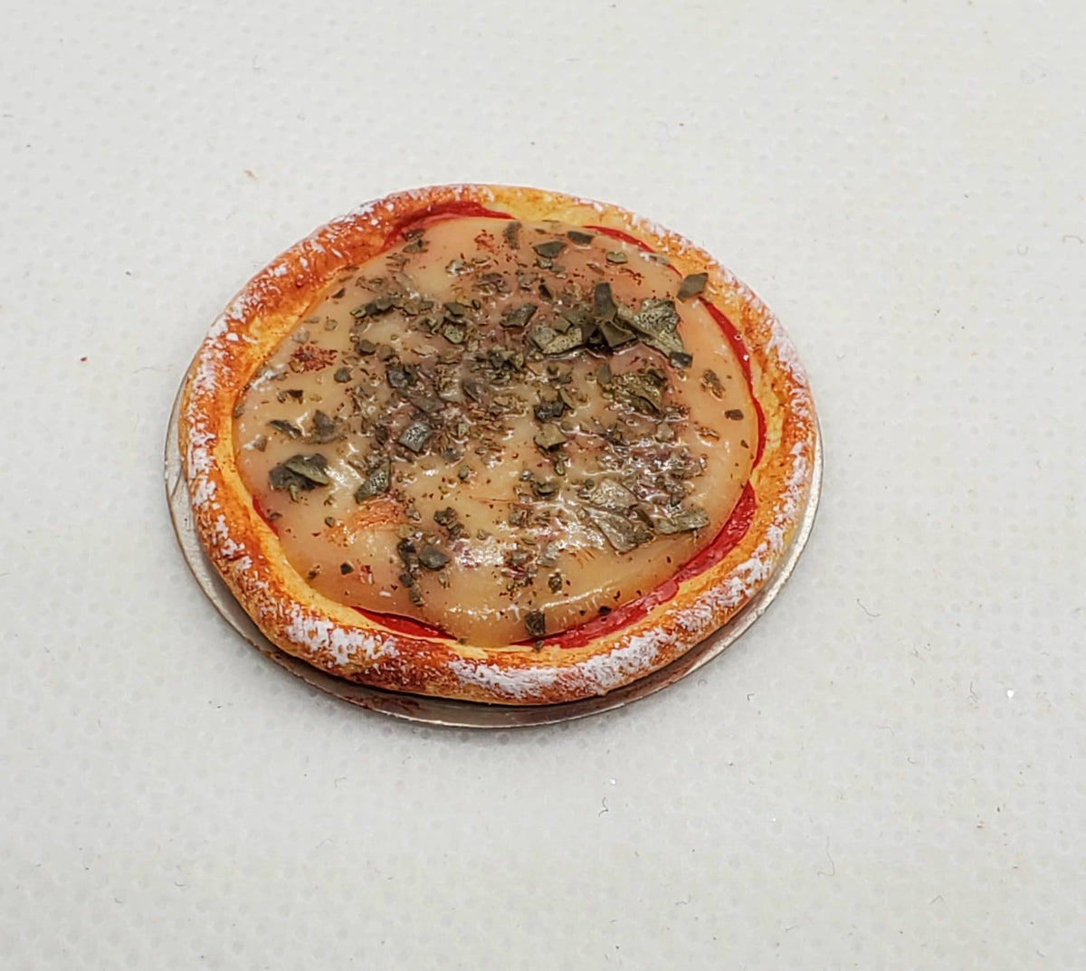 Chef Gina's miniature cheese pizza dollhouse accessory with detailed crust and toppings
