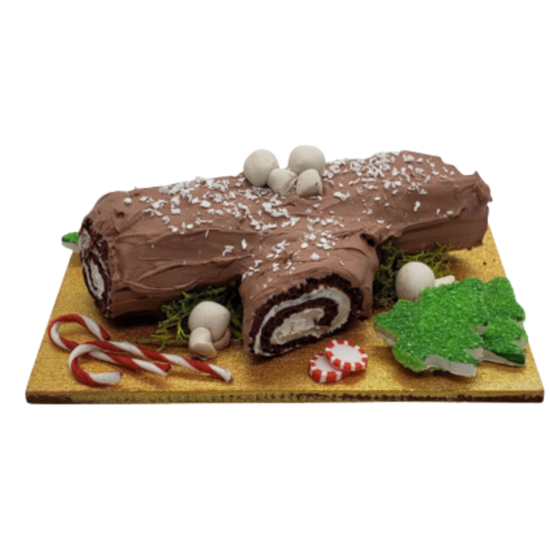 Miniature Christmas Swiss log roll decorated with chocolate icing, candy canes, and festive accents