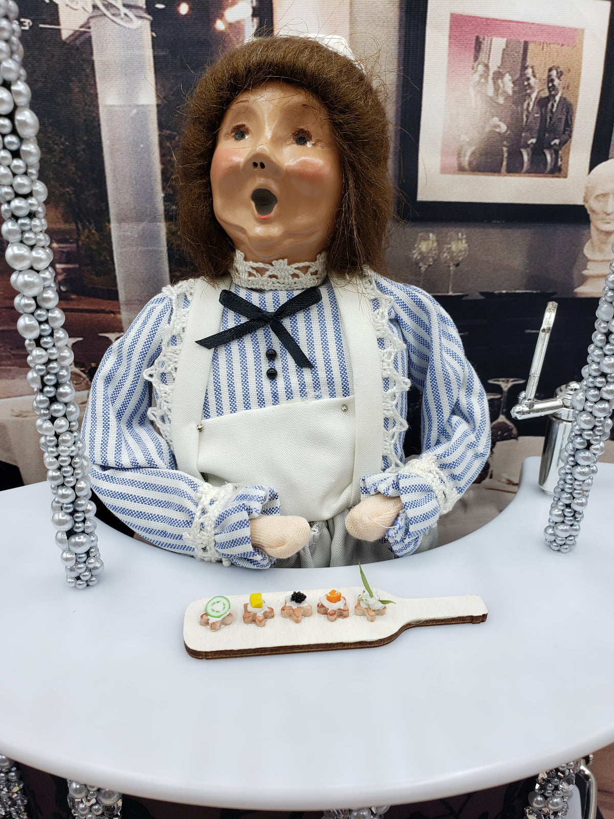Chef Gina's miniature hors d'oeuvres platter with assorted bite-sized appetizers on a small wooden board