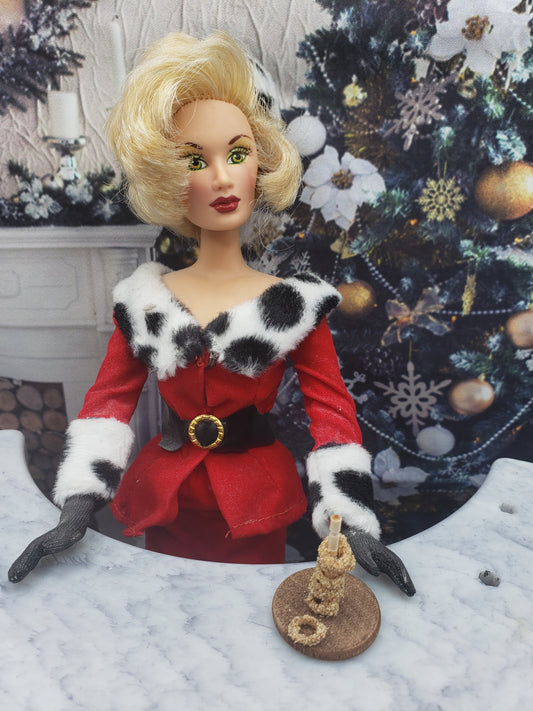 Miniature onion rings for dolls displayed on a small plate held by a doll in festive red and black outfit