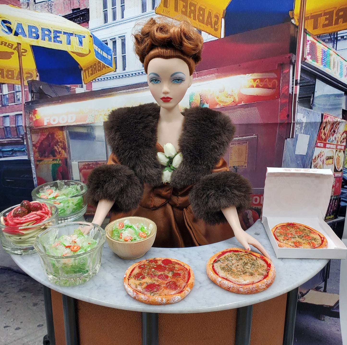 Chef Gina's miniature pizza Fashion doll food set with two pizzas and salads on a table with a fashion doll