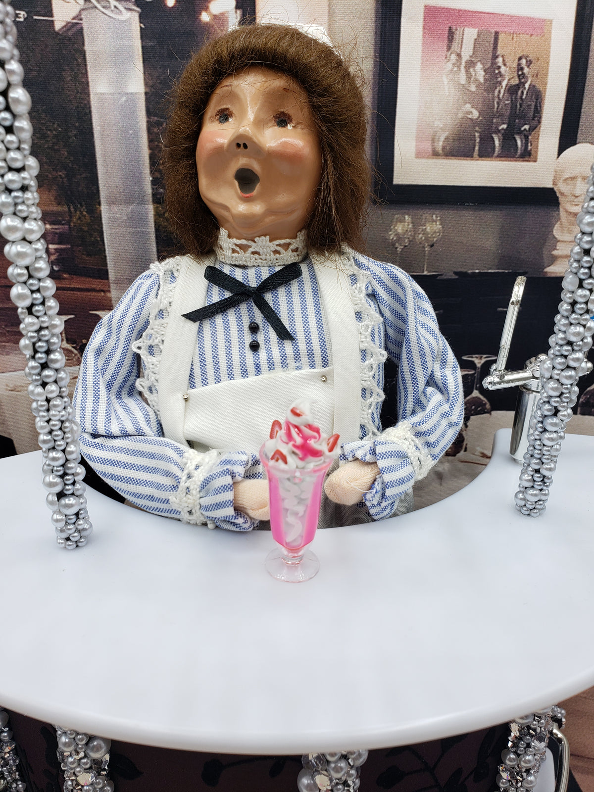 Chef Gina's miniature strawberry sundae for dolls displayed in a clear glass with pink syrup and whipped cream