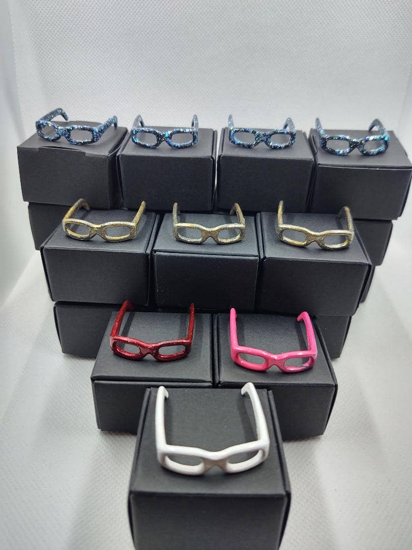 Set 1 Barbie eyeglasses with black boxes