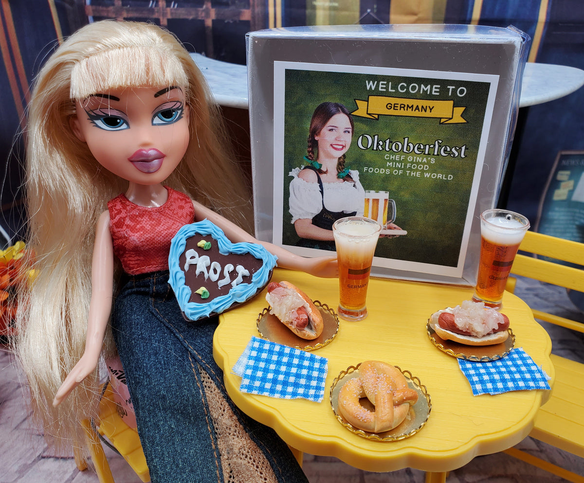 1 6 scale Oktoberfest doll food set with blonde doll holding heart shaped cookie and miniature beer pretzels
