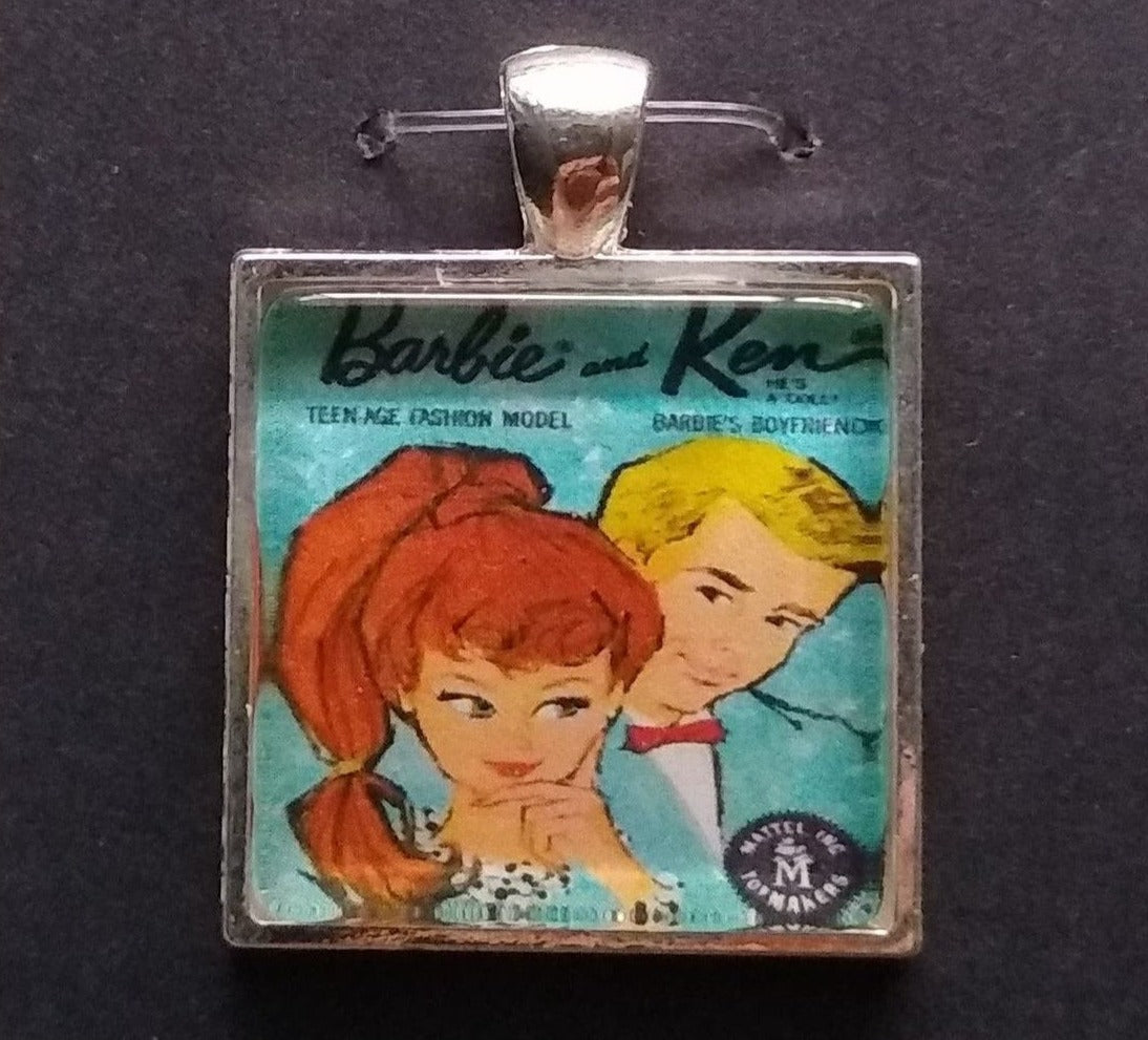 Square pendant featuring vintage illustration of Barbie and Ken on Barbie Ken necklace