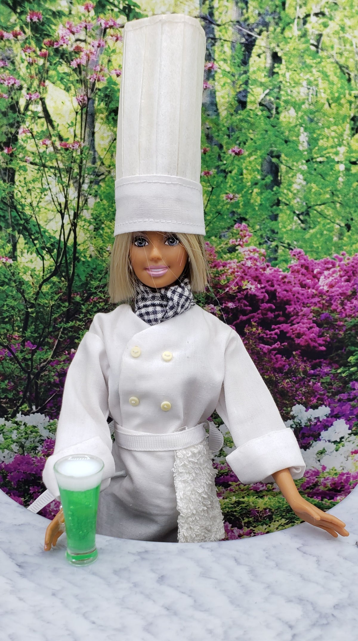Chef Gina's 1 6 scale green beer prop for fashion dolls held by a doll dressed as a chef in a garden setting