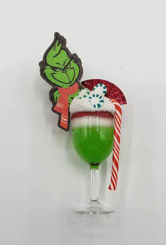 Chef Gina's Mini Food Grinch Christmas doll drink with green layered festive cocktail and candy cane garnish