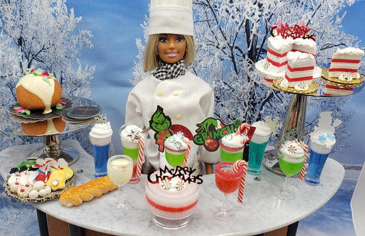Grinch themed Christmas candy drink and holiday treats by Chef Gina's Mini Food displayed with a doll chef in winter setting