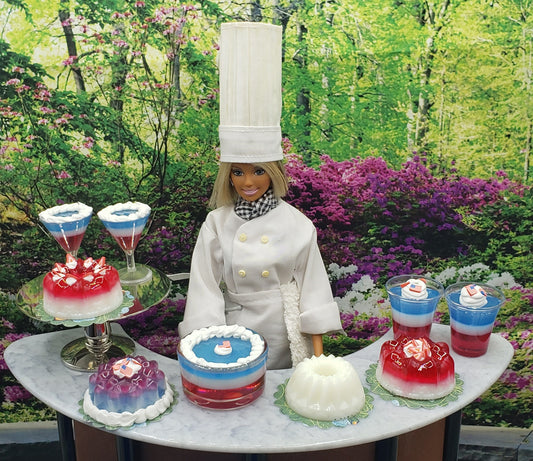 Chef doll with 1 4th scale flag jello dessert and other miniature layered jello desserts on a marble table