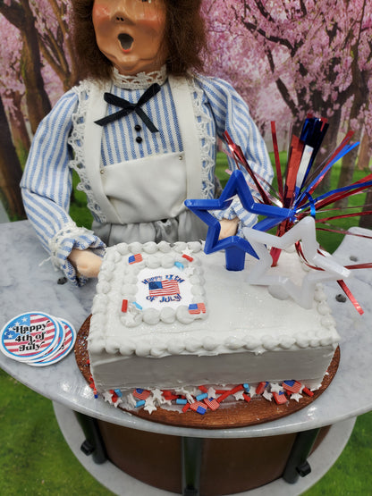 4th of July doll cake 1:4th scale dolls with festive decorations and a cheerful chef figure