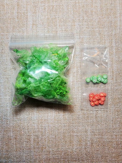 Miniature salad kit for dolls with vibrant green lettuce and tiny sliced vegetables