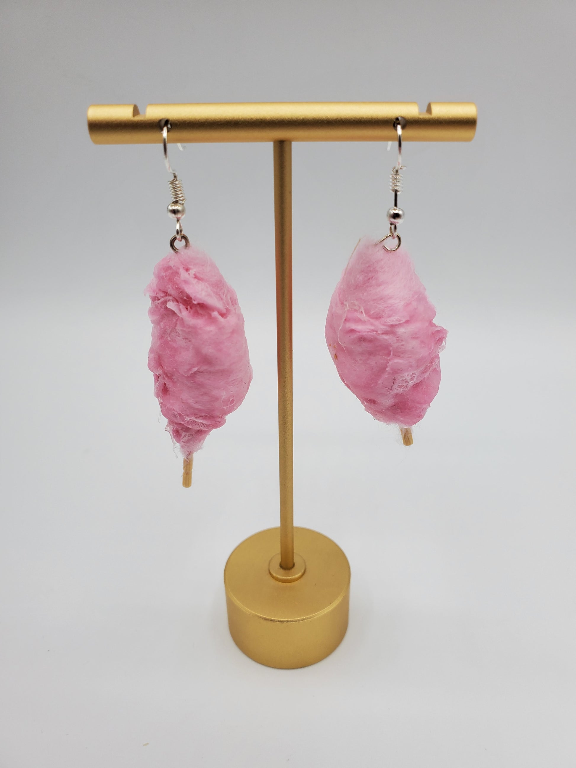 Chef Gina's Mini Food pink cotton candy earrings hanging on gold display stand