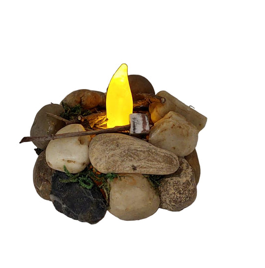 Small stone fire pit with a flickering lit candle
