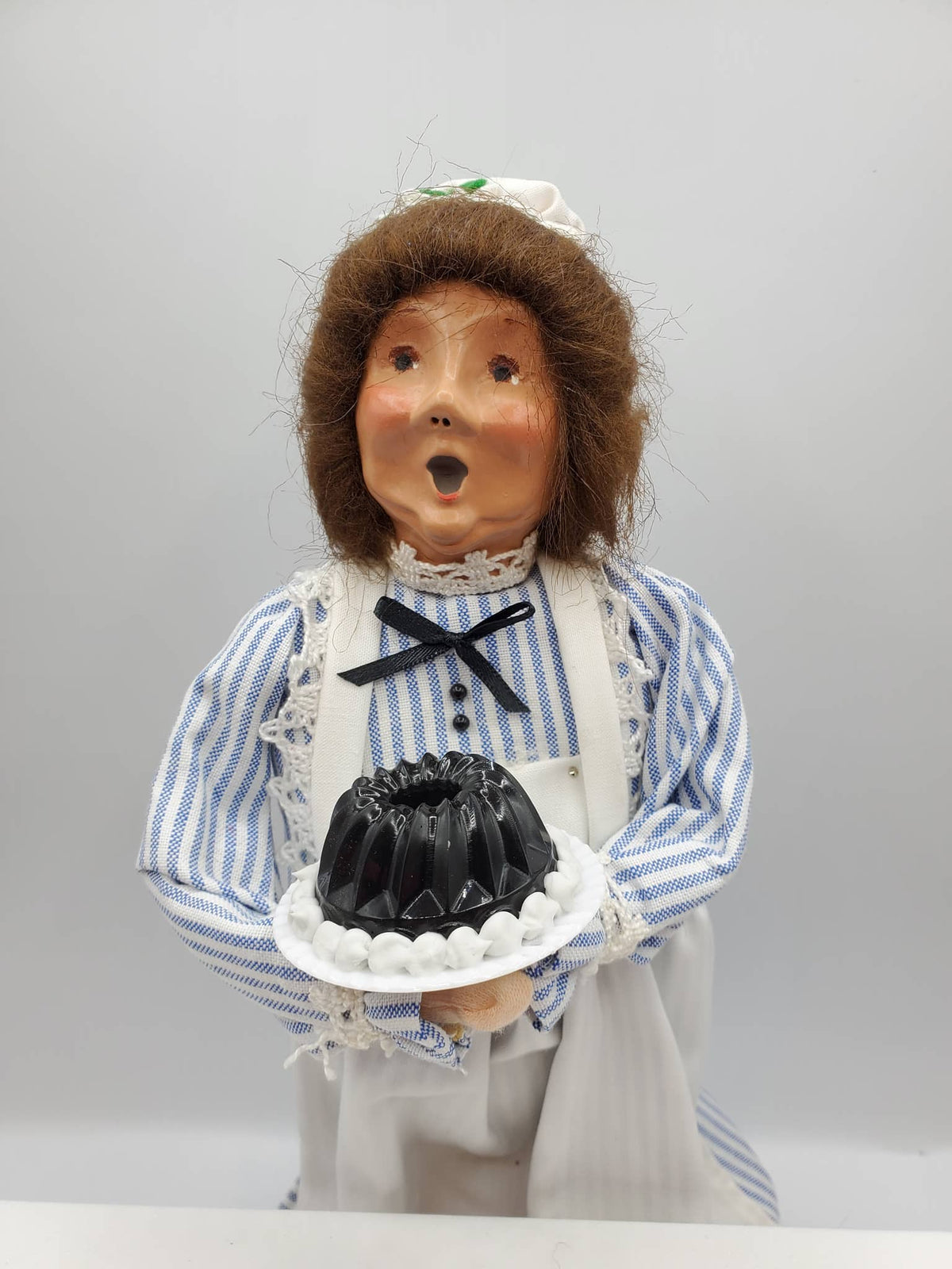 Chef Gina's Mini Food Doll Holding a Classic Jello Mold in a Blue and White Striped Outfit