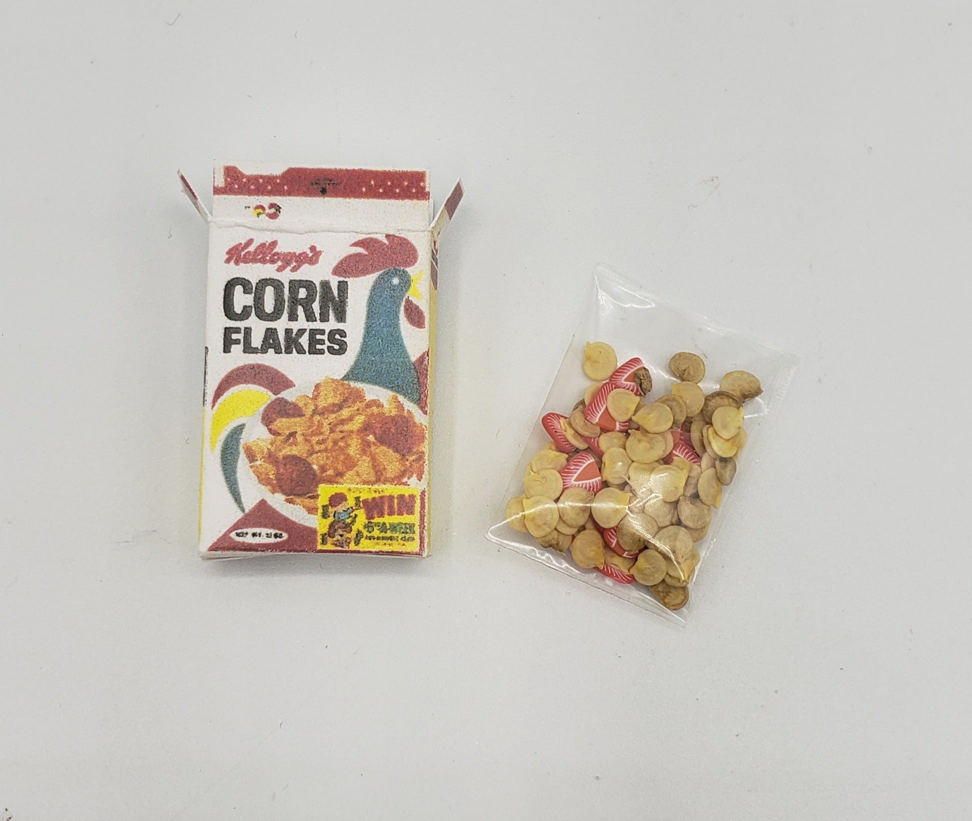 Chef Gina's miniature corn flakes for dolls with a tiny cereal box and a small bag of flakes