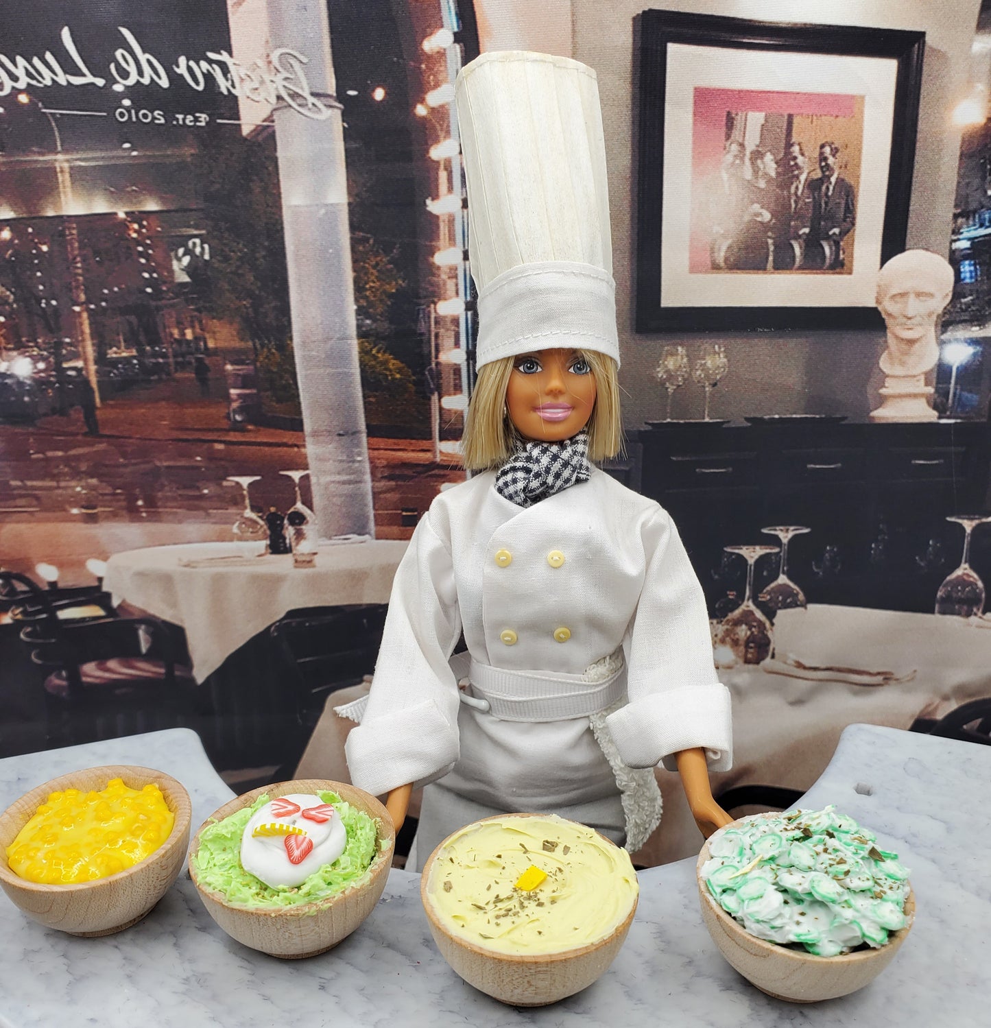 Chef Gina's mini pistachio dessert for dolls displayed in small bowls with a doll chef in kitchen setting