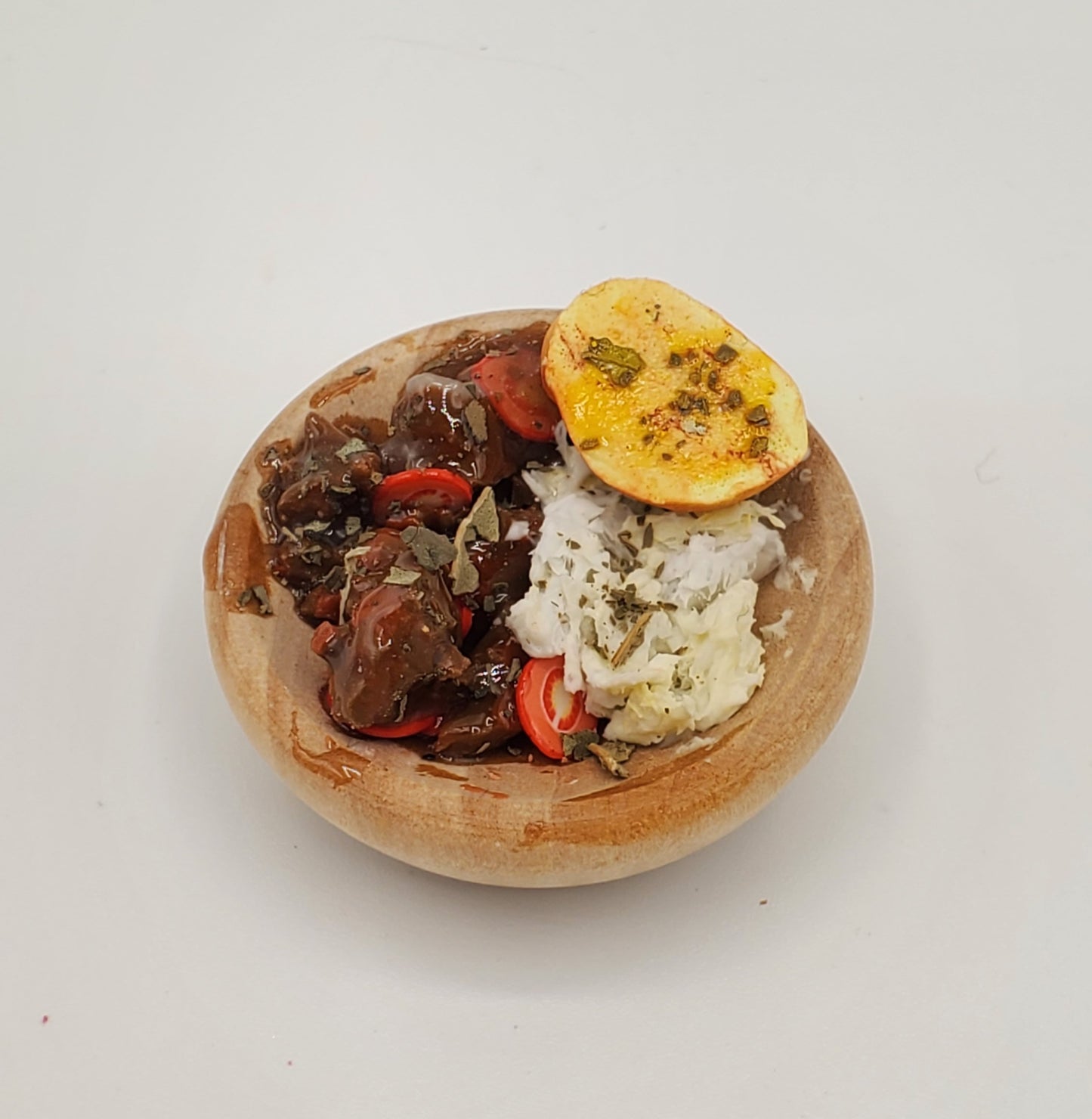 Chef Gina's mini pot roast for dolls with carrots mashed potatoes and a baked potato half in a wooden bowl