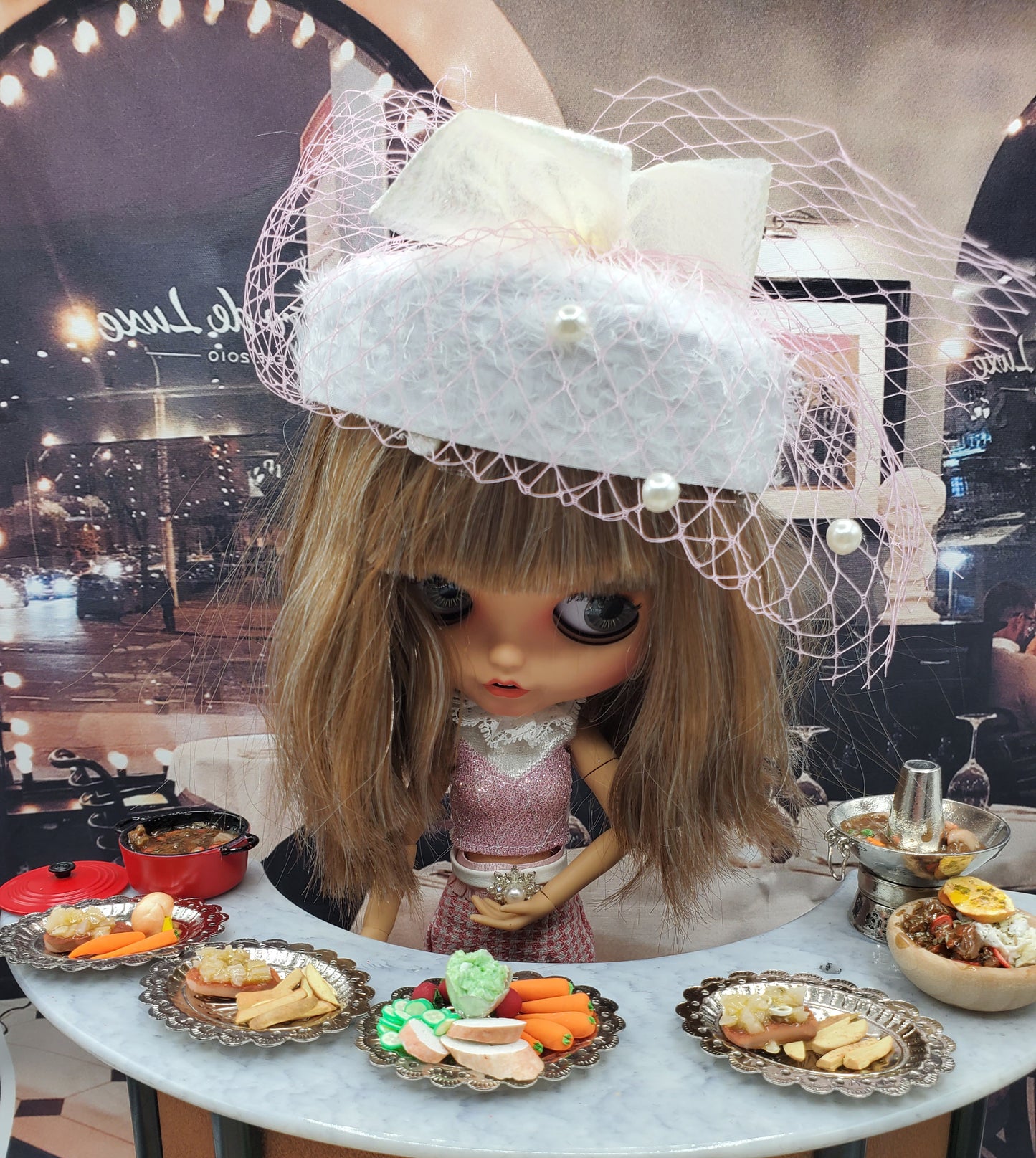 Chef Gina's mini pot roast for dolls served on silver trays with a doll wearing a white hat in a cafe setting