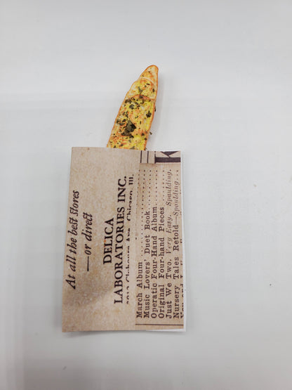 Chef Gina's miniature baguette bread with garlic and herbs on top in packaging