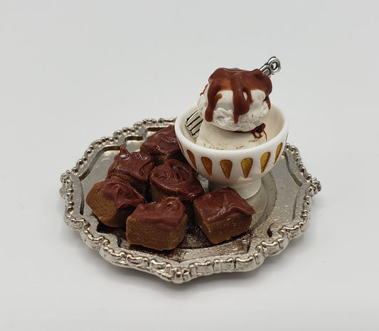 Chef Gina's miniature brownies for dolls served on a silver tray with ice cream and chocolate drizzle