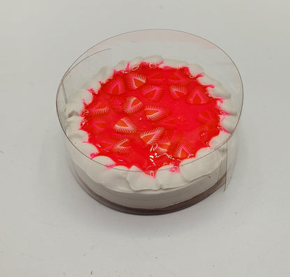 Chef Gina's miniature cheesecake for dolls with red strawberry topping and whipped cream edges