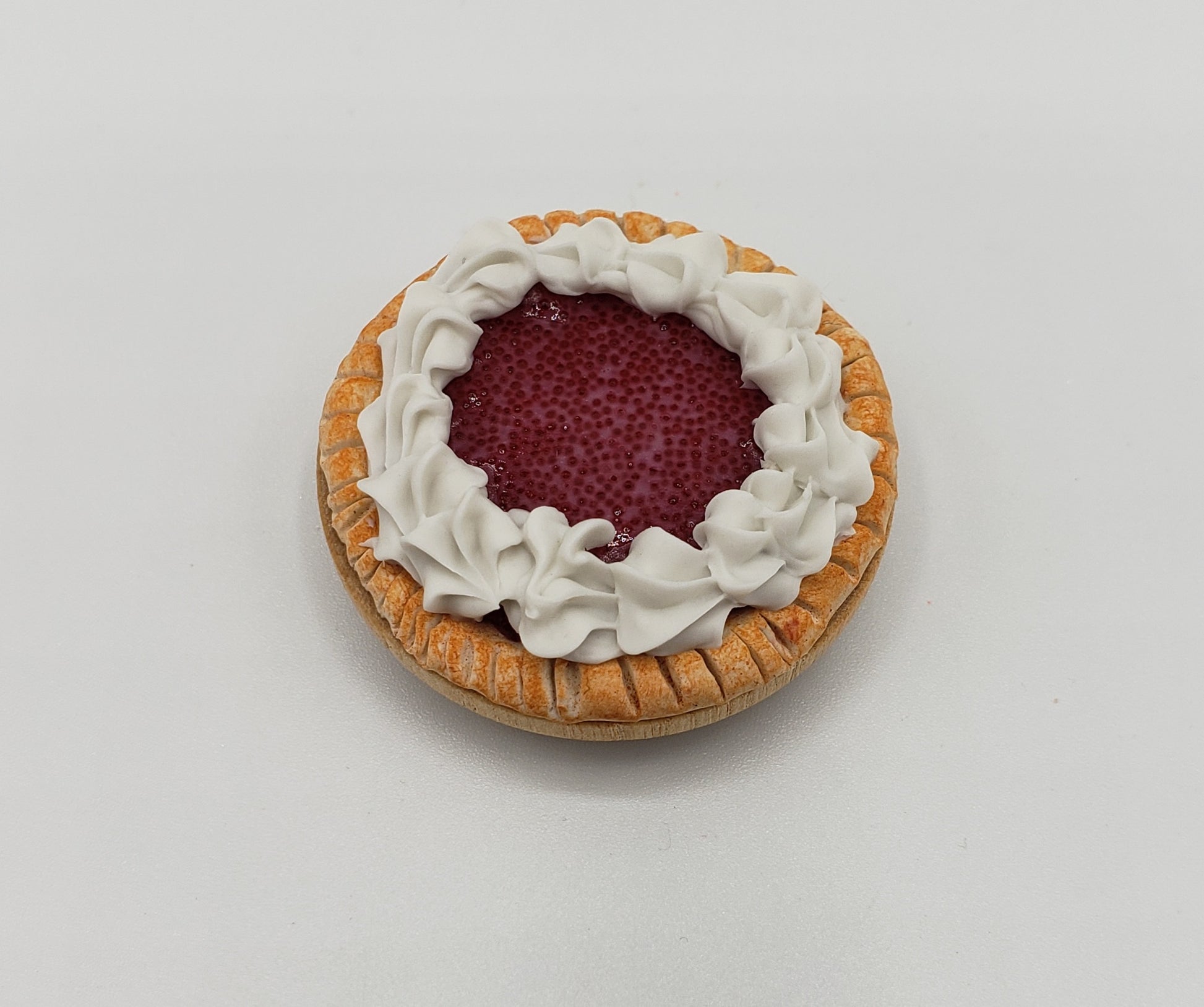 Chef Gina's miniature cherry pie for dolls with detailed crust and whipped cream topping