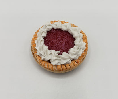 Chef Gina's miniature cherry pie for dolls with detailed crust and whipped cream topping