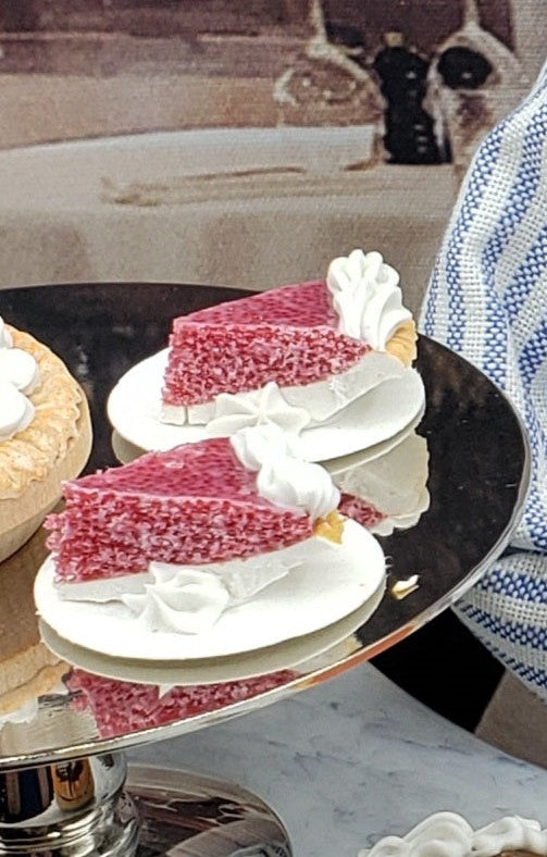 Chef Ginas miniature cherry pie for dolls slice with whipped cream on white plate