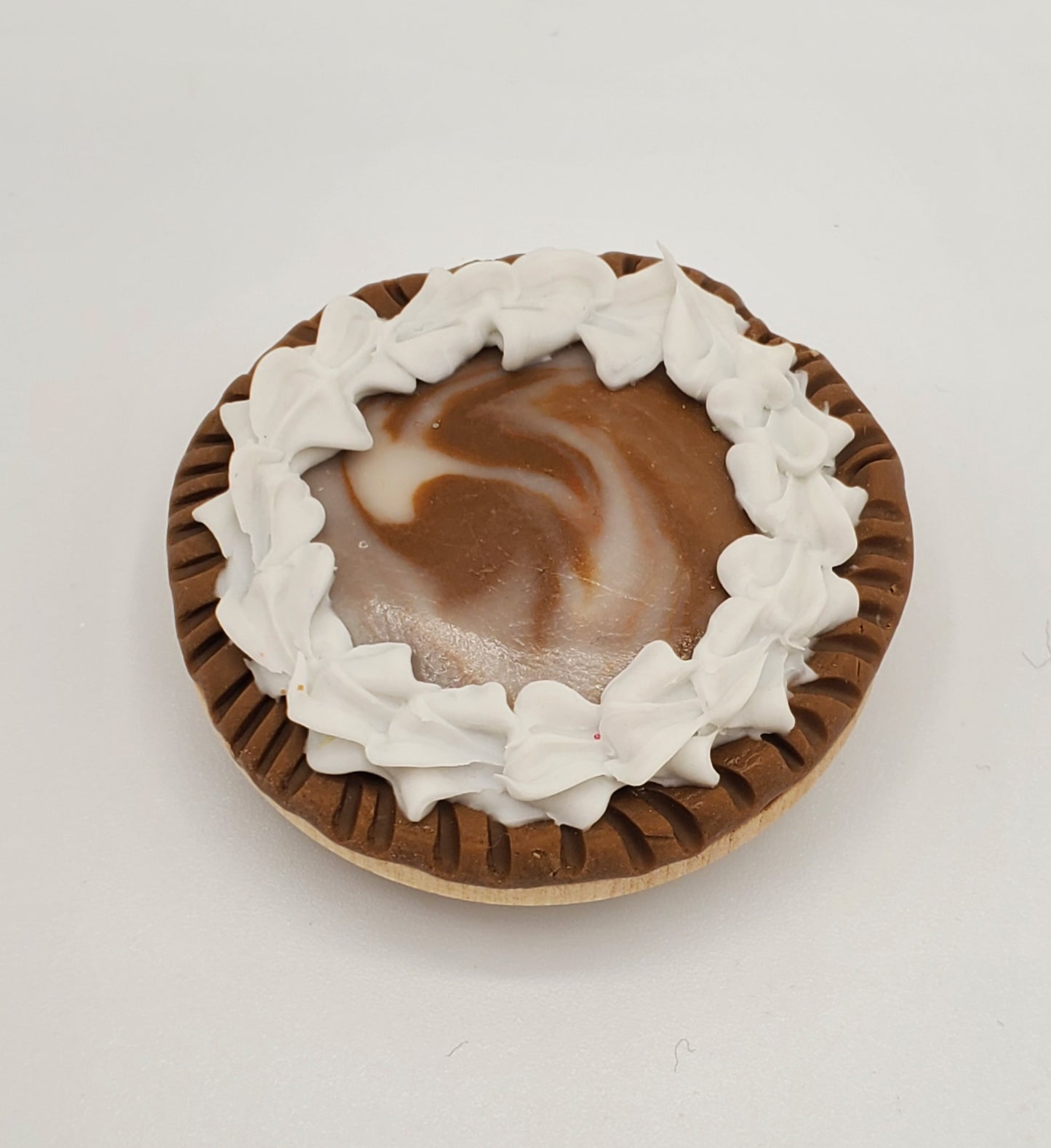 Chef Gina's miniature chocolate Oreo pie with whipped cream on top in a brown crust