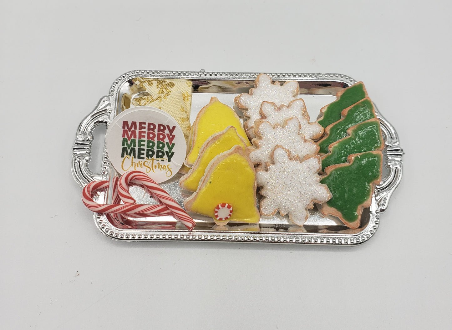 Miniature Christmas cookies for dolls on a silver tray including candy canes and festive shapes by Chef Gina's