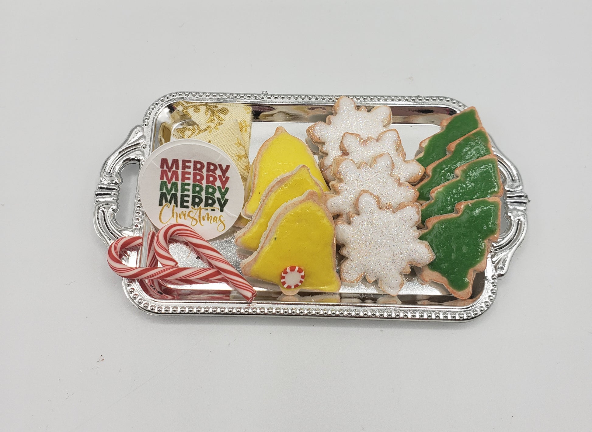 Miniature Christmas cookies for dolls on a silver tray including candy canes and festive shapes by Chef Gina's