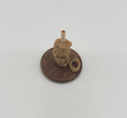 Chef Gina's miniature onion rings for dolls displayed stacked on a small rod on a round base