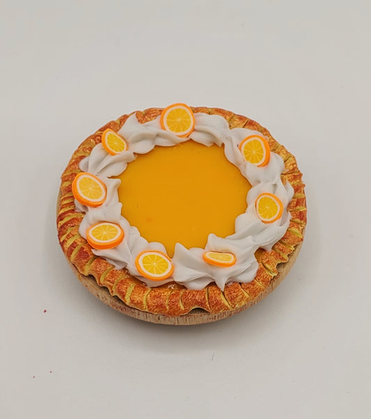 Chef Gina's miniature orange cream pie with whipped cream and small orange slice decorations