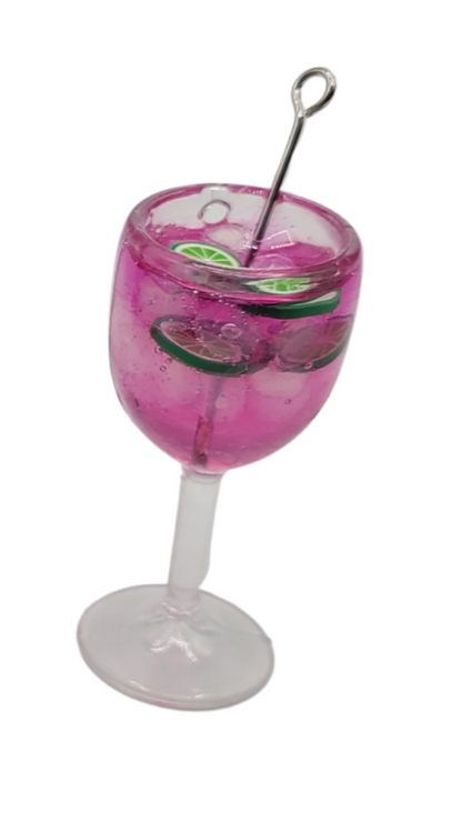 Miniature pink lime doll drink in clear glass with lime slices and silver stirrer by Chef Ginas Mini Food