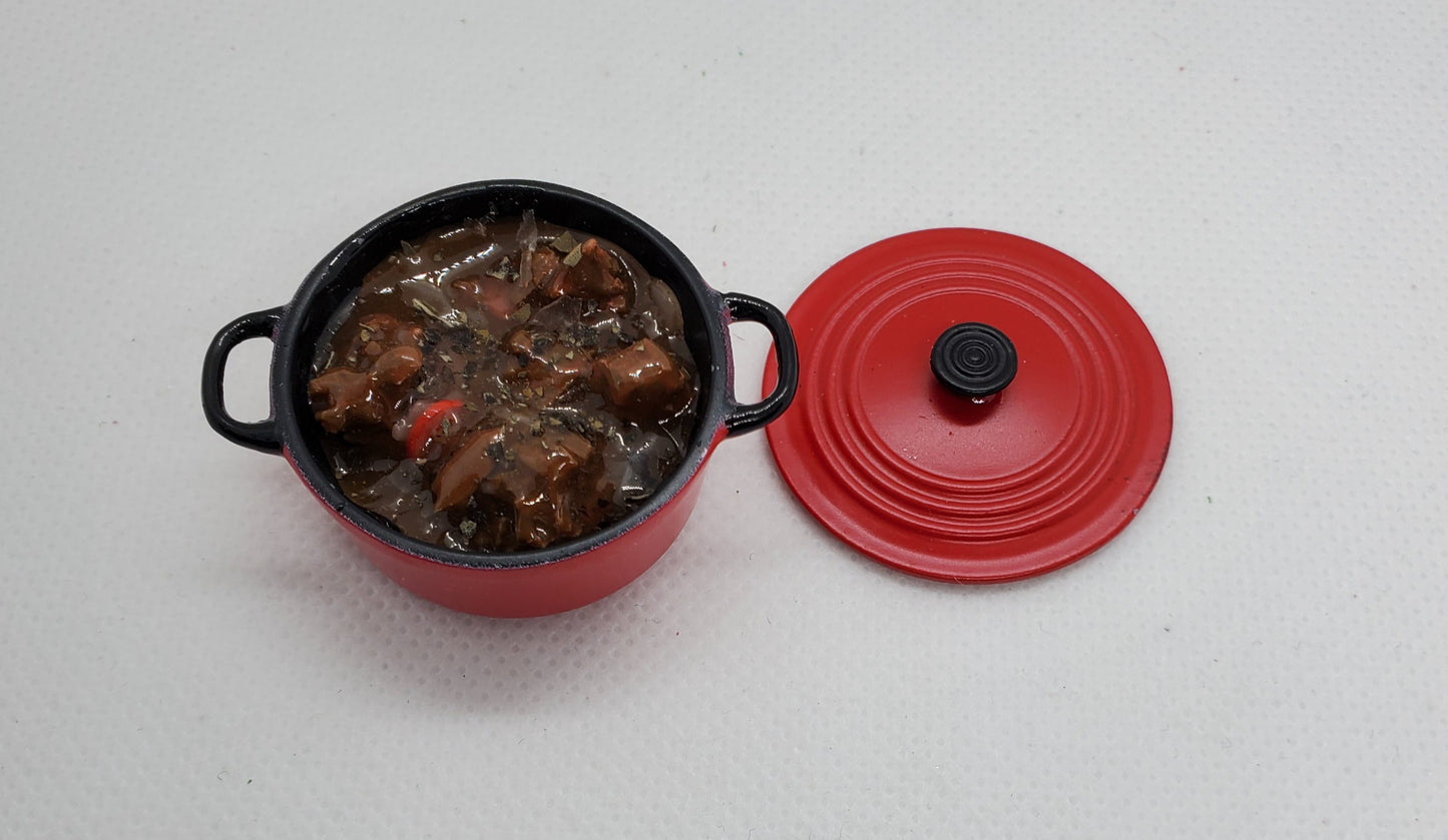 Chef Gina's miniature pot roast for dolls in a red mini cooking pot with lid off displayed