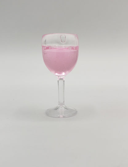 Chef Gina's miniature rose wine for fashion dolls in clear glass with pink liquid inside