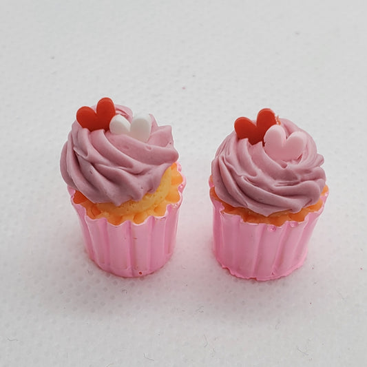 Chef Gina's miniature Valentine's cupcakes with pink frosting and heart-shaped decorations in pink liners
