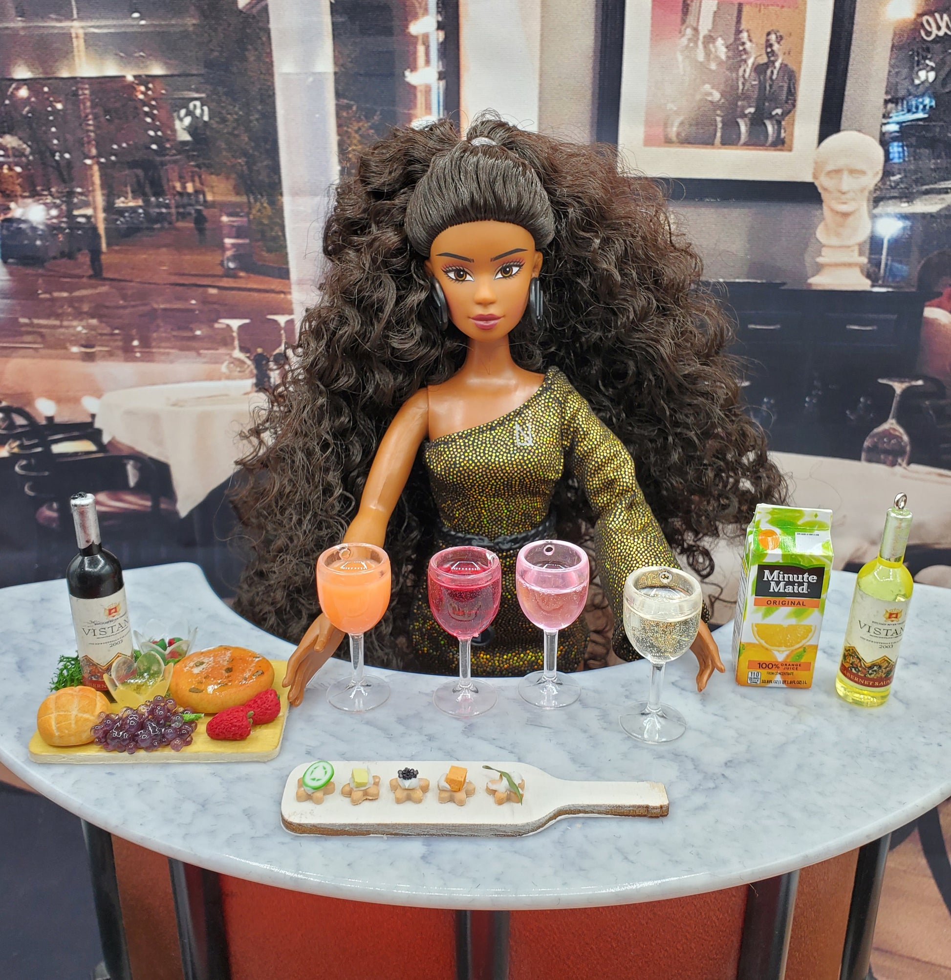Miniature wine cheese tray with wine bottles and glasses served by doll from Chef Gina's Mini Food hors d'oeuvres