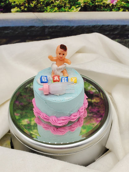 Chef Ginas one sixth scale baby cake with baby doll figure and colorful blocks on blue icing