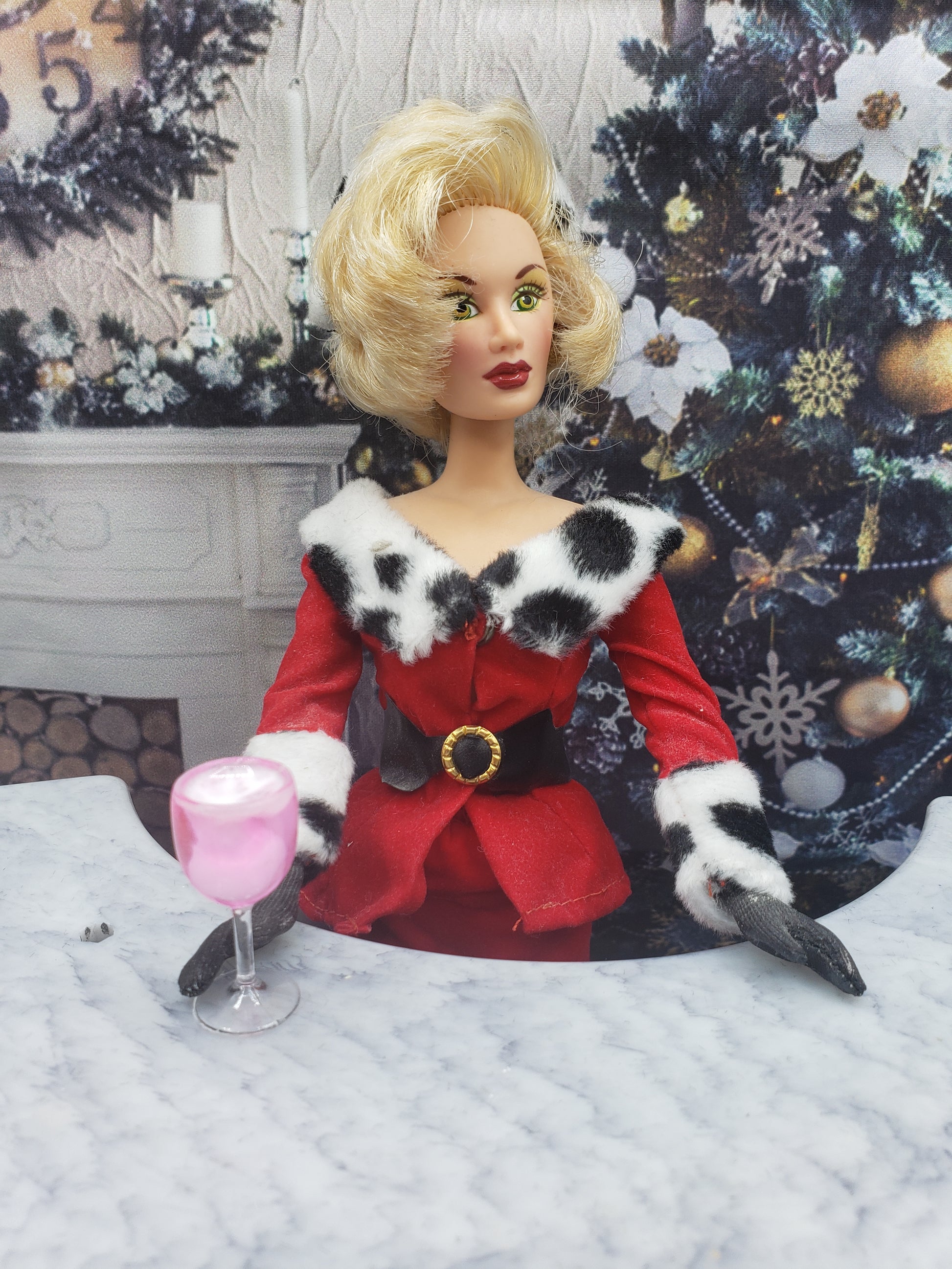 Chef Gina's one sixth scale party punch held by doll in red and white fur-trimmed holiday outfit