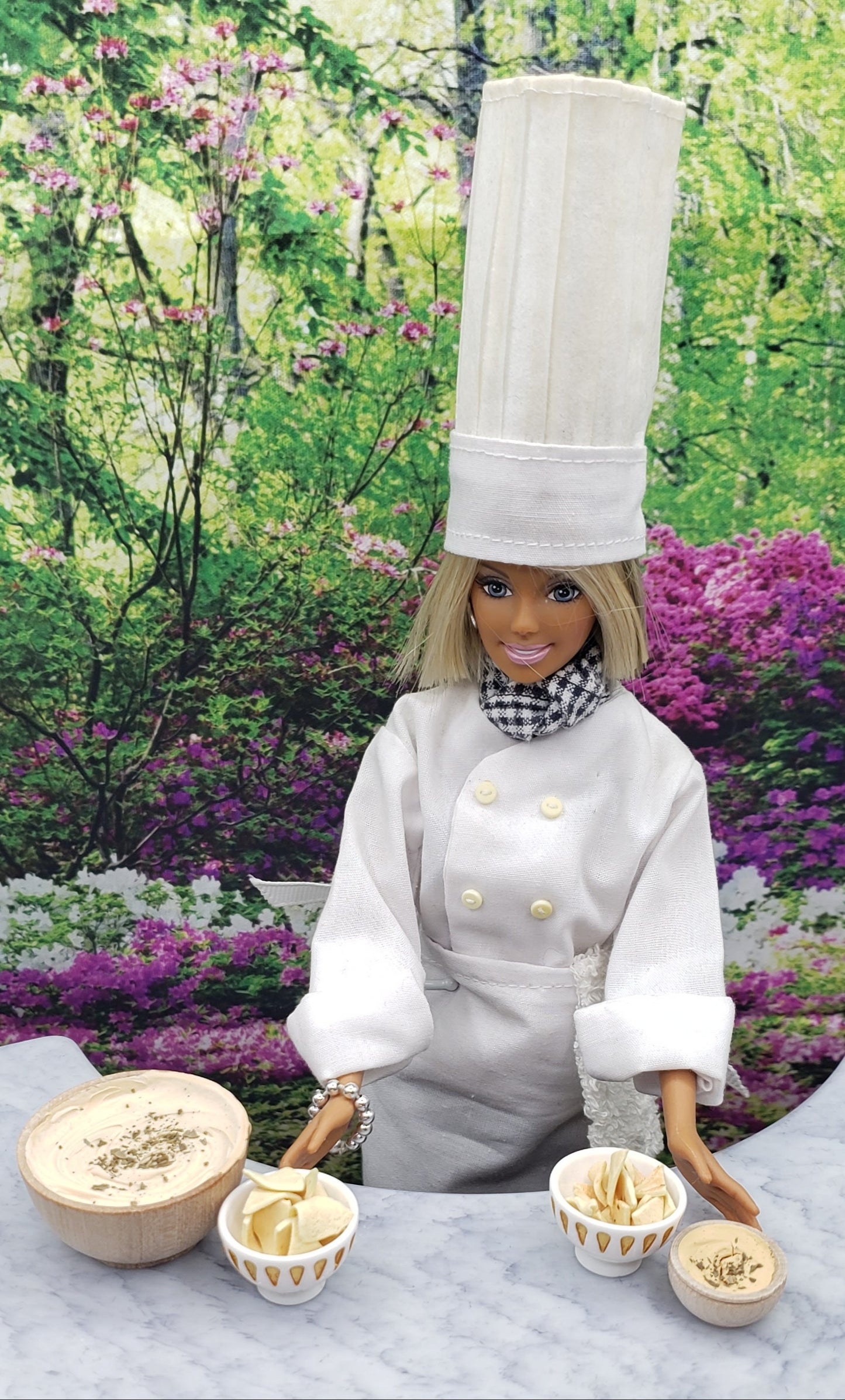 Chef Gina's miniature chef doll with one sixth scale tortilla chips and dip accessories on marble table