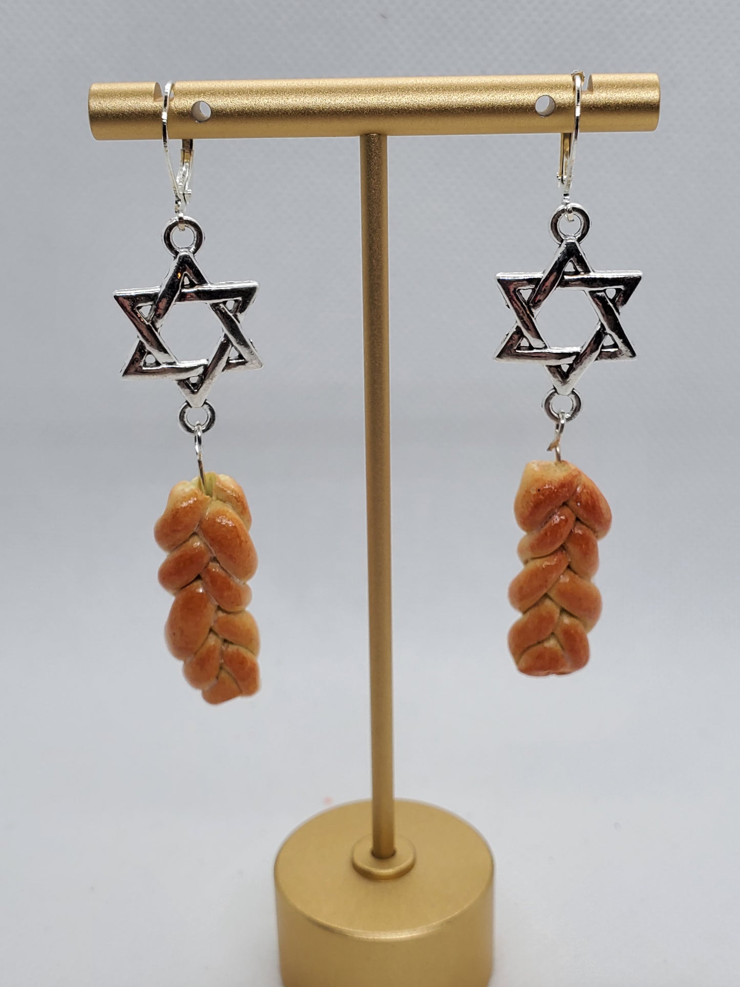 Chef Gina's miniature challah bread jewelry earrings with Star of David charms hanging on gold stand