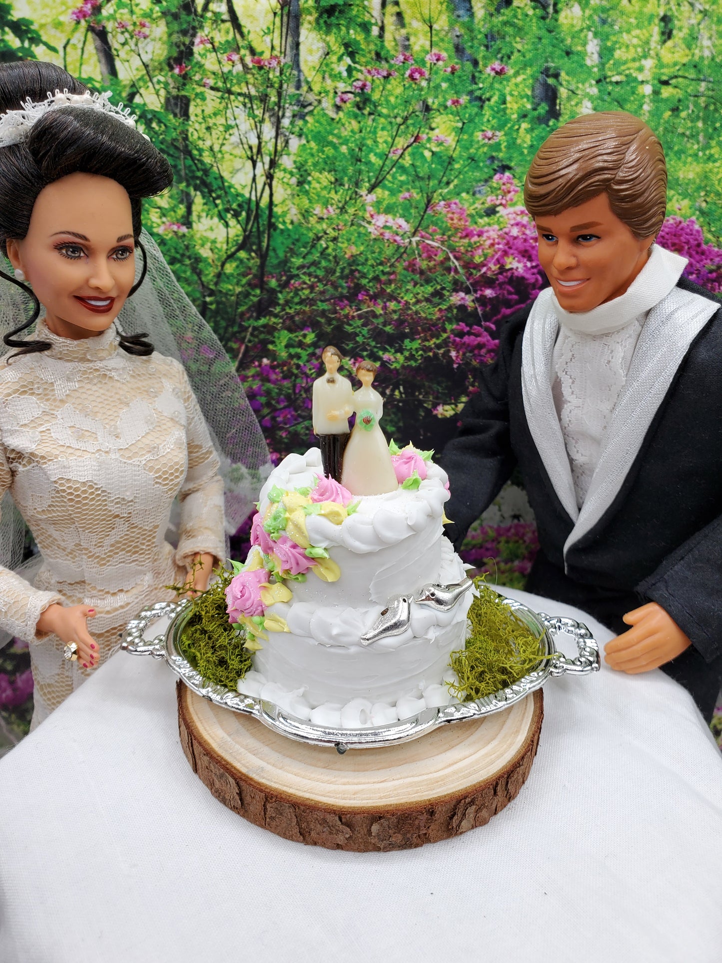 1:6 scale wedding cake accessory from Chef Gina's Mini Food with bride and groom dolls in outdoor setting
