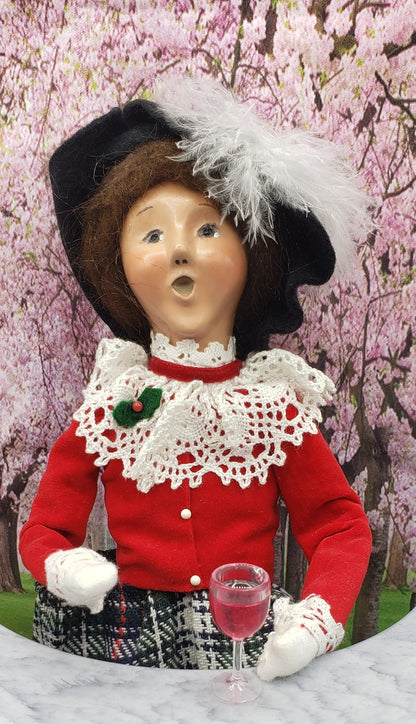 1:6 scale wine glass for dolls held by vintage doll in red outfit with lace collar and feathered hat